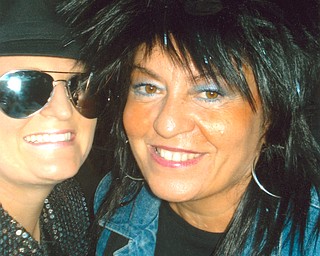Joanne Kalbasky, right, of Struthers was dressed as Tina Turner for a 30th birthday bash for her daughter, Lisa Saxon (as Michael Jackson).