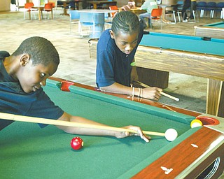 Tamboura Jenkins, left, and David Williams, both 12, are members of Boys and Girls Club of Youngstown. The organization hopes to increase membership this summer as the threat looms that North Side Pool may not open because of city budget constraints.