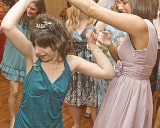 LISA-ANN ISHIHARA | THE VINDICATOR...Paige Goodman and Lauren Stevens, both of Liberty High School, dance at the annual tri county special needs prom, held at Anthone's.