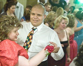 LISA-ANN ISHIHARA | THE VINDICATOR...L-R Jordan Bertolette of Columbiana High and Romann Williams of Fitch dance at the annual tri county special needs prom, held at Anthone's.