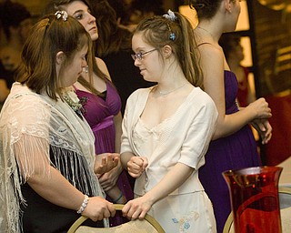LISA-ANN ISHIHARA | THE VINDICATOR...Erica Double, 16, Boardman and Lizie Luman, 18, Boardman, chat at the annual tri county special needs prom, held at Anthone's.