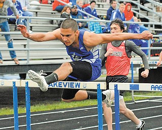 Lakeview’s Toma Leveto clears a hurdle during the finals of the boys 110 meter hurdles during the All-American Conference White Tier meet Wednesday in Cortland. Leveto won the event and also won the long jump to help lead the Bulldogs to the team title.