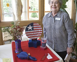 LISA-ANN ISHIHARA | THE VINDICATOR..Rose Marie Ruth poses with her submission for Stars & Stripes, receiving Second Premium in the Garden Forum Spring Flower show at Fellows Riverside Gardens.