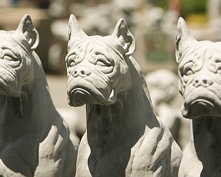 ROBERT K. YOSAY | THE VINDICATOR...Standing guard three concrete boxers at Farmer Dave's Gift and Garden Shoppe in North Lima -- 30-