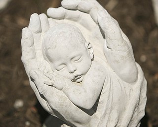 ROBERT K. YOSAY | THE VINDICATOR..In Gods Hands - a popular item - at Farmer Dave's Gift and Garden Shoppe in North Lima -- 30-