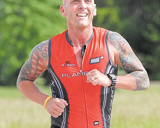 Bob Dimaiolo gets a smile on his face as he is about to finish the race..