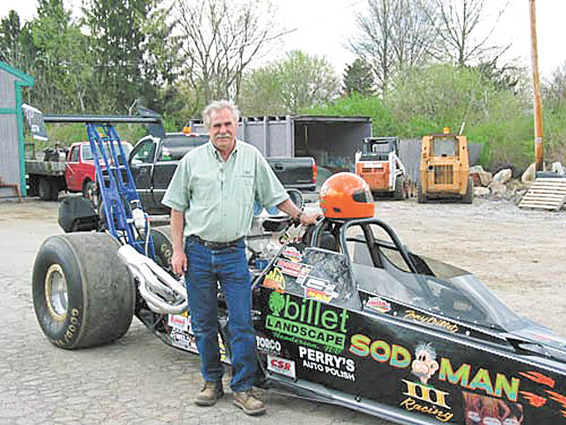 Boardman drag racer Tony Billet poses with his car, Sod Man III, which was destroyed recently in a fiery crash.
