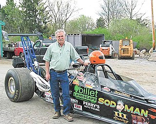 Boardman drag racer Tony Billet poses with his car, Sod Man III, which was destroyed recently in a fiery crash.