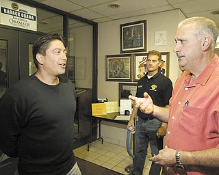 Keith Fingerhut, left, a transfer employee to GM Lordstown from GM’s closed Wilmington, Del., facility, talks with Jim Graham, president of United Auto Workers of America Local 1112, during a break in an orientation session. Fingerhut said he is excited about being at Lordstown and building the Chevrolet Cruze.