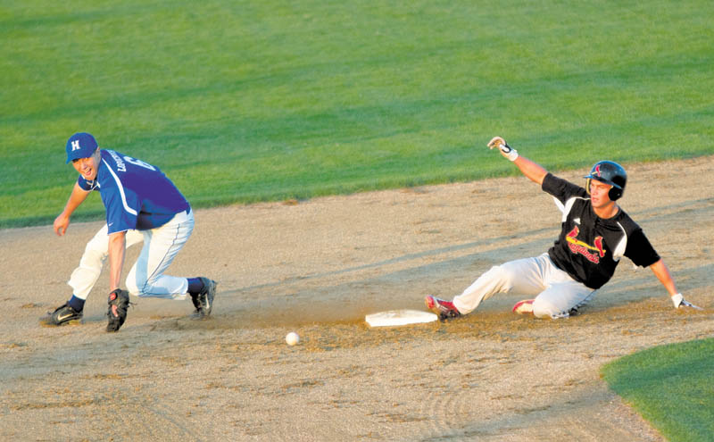 Nick Benson (7) safely reaches second base after Hubbard's Mike Lopuchorsky(6) bobbles the ball during the second inning of a Division II District Semi Finals Game at Cene Field on Wednesday evening.