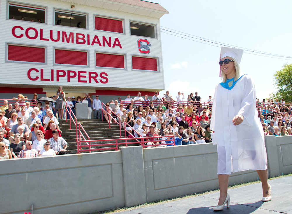 Geoffrey Hauschild|The Vindicator.Graduate, Chelsea Rae Macklin, receives her diplomia and crosses the stage during Columbiana High School's 2010 Commencement Ceremony at Firestone Park on Sunday afternoon.
