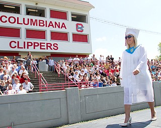 Geoffrey Hauschild|The Vindicator.Graduate, Chelsea Rae Macklin, receives her diplomia and crosses the stage during Columbiana High School's 2010 Commencement Ceremony at Firestone Park on Sunday afternoon.