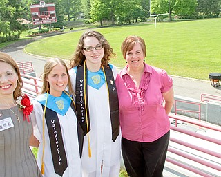 Geoffrey Hauschild|The Vindicator.Ruth Williamson, and her daughter, Jennifer Williamson, stand alongside Irene Sherrell Coy and her mother, Laurie Coy, following Columbiana High School's 2010 Commencement Ceremony at Firestone Park on Sunday afternoon.