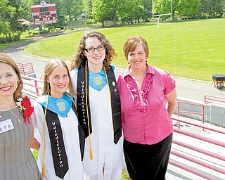 Little did friends Ruth Williamson,  left, and Laurie Coy, right, know that, when they had their children at the same time in 1992, the two girls would grow up to be co-valedictorians at Columbiana High School. Jennifer Williamson, second from left, and Irene Sherrell Coy, second from right, both addressed their classmates Sunday.