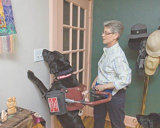 April gets ready to turn on the light switch for Tara McKibben of Youngstown.