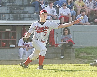 Columbiana pitcher Hank Schlueter fires a throw to fi rst base after fielding a bunt attempt during a recent game. The Clippers will play Buckeye Central in a Division IV regional baseball game on Thursday.
