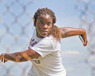 Boardman senior Valerie Hood practices throwing the discus at Boardman Stadium on Tuesday. Hood will compete in the Division I regional track and field meet starting today.