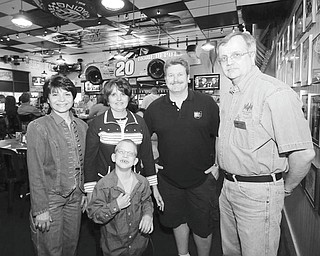 Mark Stahl | The Vindicator:
The Mahoning Valley Mustang and Northeastern Ohio Camaro Clubs are bringing the annual Mustang vs. Camaro Showdown to the Valley. This year’s event, planned for June 5, will be at Quaker Steak and Lube in Austintown and will benefit Angels of Easter Seals. Above, members of the groups gather at Quaker Steak & Lube with Hunter Crites, an Easter Seals client, center. From left are Carol O’Neill and Jean Bennett, Angels of Easter Seals committee members; Chris Slocum of NEOCC; and Bob Macabobby of MVM.