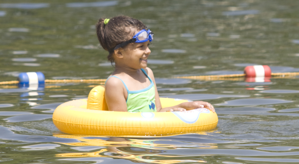 LISA-ANN ISHIHARA | THE VINDICATOR..Lydia Graves (5) of Akron enjoys the sun and cool water in her floatee during day one of Jonesfest at Nelson Ledges Quarry Park.