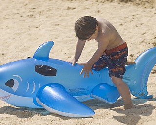 LISA-ANN ISHIHARA | THE VINDICATOR..Kaiden Jewell (4) of Hudson hangs out with his inflatable shark during day one of Jonesfest at Nelson Ledges Quarry Park.