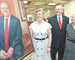 Youngstown State University President David C. Sweet is flanked by two key women in his life, his wife, Pat, left, and his mother, Esther Sweet, as they admire his official presidential portrait.