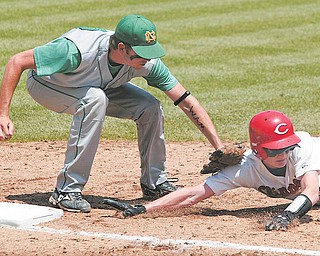 Michael Lehmkuhle, The Advocate.Newark Catholic's Kevin Cox tags out Columbiana's Andrew Burdick after a throw-back to first base Thursday afternoon during the Green Wave 1-0 victory advancing them to the Division IV state title game.