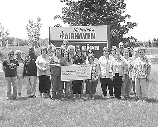 Volunteer staff and employees from Fairhaven Industries sponsored a rummage sale recently at the Champion Fairhaven Workshop to raise funds for the new location of the Animal Welfare League of Trumbull County on Educational Highway in Warren. The event raised $2,500. Volunteers for the sale are, from left, Michelle Swonger, Sue Shrader, Richard Turner, Janis Metzendorf, Karen Marberger, Dave Sekarek, Tracy Blakeley, Amanda Cartright, Debbie Agostinelli (TC Animal Welfare), JoAnne Pecorelli, Dennise Lindsey, Holly Yannucci, Angie Terbovich, Leah Yannucci, Cindy Bailey, Robin Hefner, Mary Miller, Rick Mistovich, Cathy Jones, Pat Larkins and Bridgett Ursu