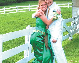 Leanna Hartsough, a Canfield High School junior, and her date, Mike Drotleff, a senior, are at Speece Lake in Canfield.