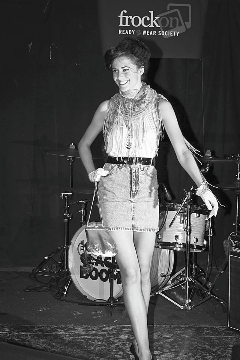 Maggie Wagner models an outfit created by Emily Plaskett, designer, from items donated to FrockOn by the Village Discount Outlet on Mahoning Avenue, Youngstown. Wagner walked the runway during a Going Green party May 29 at the Cedars in Youngstown. The party promoted recession chic thrift shopping during tough economic times.