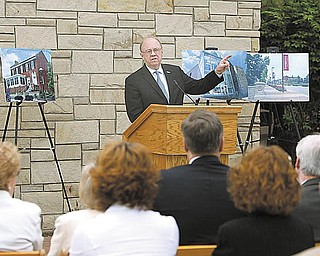 Dr. David Sweet, president of Youngstown State University, talks Monday to offi cials and community members about the changes to the East Gateway of campus. The East Campus Gateway project was designed to enhance the appearance of one of the main entrances to campus.