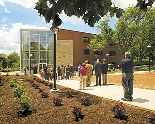 Offi cials and community members celebrate the completion of East Campus Gateway. The project, along University Plaza on the east side of campus, includes a glassed entryway to the Tod Hall administration building, major renovations to Coffelt Hall, a visitors parking lot, a new marquee sign outside Bliss Hall and new lighting, landscaping, banners and a traffic circle. 