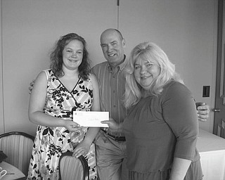 A highlight of the May 20 meeting of Youngstown Lions Club was the presentation of the Rita Merz Memorial Scholarship to Youngstown State University, given in memory of Rita Merz, who had been a member of the Lions Club. The recipient is chosen by members of her family. Presenting the award to Stephanie Baker, left, a graduate of Leetonia High School, are Paul Merz and Jeannie Antol-Watson. The Lions are setting up an endowment so a similar scholarship can be awarded annually.