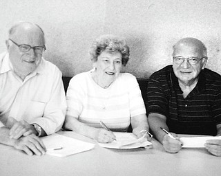South High School Alumni Association prepares for its 36th annual alumni reunion on June 25 at the Saxon Club in Youngstown. Those involved in the planning include, from left, Chuck Whitman, alumni association president, class of 1946; Elberta Bullman Scott, treasurer, class of 1939; and John Athanasen, second vice president, class of 1959.