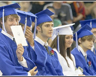 Geoffrey Hauschild|The Vindicator.Cooper Kostelic clowns around during Poland's 2010 Commencement Ceremony at the high school gymnasium on Sunday afternoon.