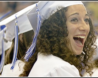 Geoffrey Hauschild|The Vindicator.Poland graduate, Anna Pompeo, reacts with suprise, and auditorium followed with applause as the supporters of one of her fellow graduates lets loose a loud noise maker, despite being asked to save applause till the end of the 2010 commencement ceremony, at the high school gymnasium on Sunday afternoon.