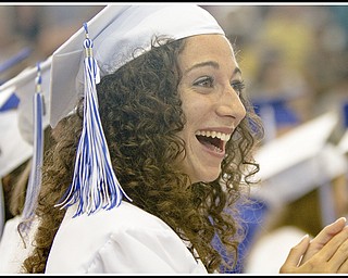Geoffrey Hauschild|The Vindicator.Poland graduate, Anna Pompeo, reacts with suprise, and auditorium followed with applause as the supporters of one of her fellow graduates lets loose a loud noise maker, despite being asked to save applause till the end of the 2010 commencement ceremony, at the high school gymnasium on Sunday afternoon.