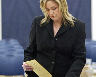 ROBERT K. YOSAY | THE VINDICATOR..Checking the diplomas is high school guidance counselor Karen Price before the grads entered the gym at Lowellville High School gym - the glass of 2010 - graduated Sunday afternoon-30