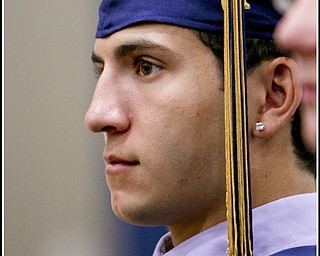 ROBERT K. YOSAY | THE VINDICATOR...Jim Perry listens intently to the Valedictorians = at Lowellville High School gym - the glass of 2010 - graduated Sunday afternoon-30