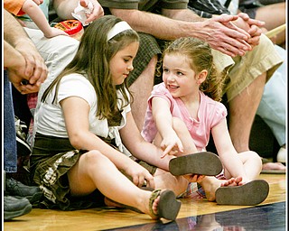 ROBERT K. YOSAY | THE VINDICATOR..Friendly banter as Samantha Dubos Macenzee Gaal (ok) 4, and 8 and both of Lowellville respectively as they girl talk.. ( at Lowellville High School gym - the glass of 2010 - graduated Sunday afternoon-30