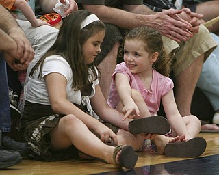 ROBERT K. YOSAY | THE VINDICATOR..Friendly banter as Samantha Dubos Macenzee Gaal (ok) 4, and 8 and both of Lowellville respectively as they girl talk.. ( at Lowellville High School gym - the glass of 2010 - graduated Sunday afternoon-30