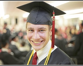 LESLIE CUSANO | THE VINDICATOR.Canfield High School valedictorian Steven Dalvin, 18, smiles for the camera before commencement Sunday. Dalvin will be attending Johns Hopkins University for biomedical engineering.