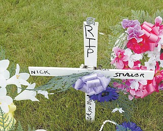 A roadside memorial stands at the site of a Saturday crash on South Avenue where motorcyclist Nicholas Stubler died.
