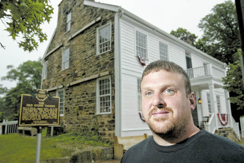 The Old Stone Tavern, the oldest building in Poland, is for sale. The South Main Street structure was built in 1804 and has been an antiques shop for the last few years. Realtor Paul Sherman of Town One Realty, which is listing the property, stands outside of the landmark.