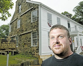 The Old Stone Tavern, the oldest building in Poland, is for sale. The South Main Street structure was built in 1804 and has been an antiques shop for the last few years. Realtor Paul Sherman of Town One Realty, which is listing the property, stands outside of the landmark.