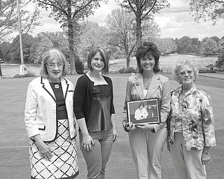 In keeping with its goal of furthering an interest in Catholic education, Catholic Collegiate presented two scholarships at its final meeting of the season. Pictured following the presentation ceremony are, from left, Barbara Banks, first vice president; Jenna Hallapy, a scholarship recipient; Tammy Porter, holding a picture of her daughter Courtney Porter, a scholarship winner; and Mary Place Thomas, scholarship chairwoman.