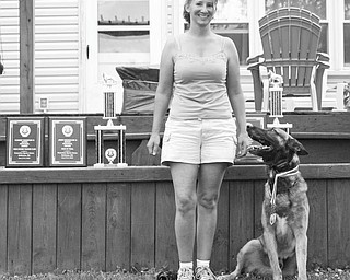A special dog has his day: Dog trainer Aimee Markle, of Youngstown, traveled to Baltimore for a Protection Sports Association working dog competition the weekend of June 5. Markle, who has been training and caring for pets for several years, began training her own dog, Funez, which is pictured, for competition in 2008. Funez, a 3 1⁄2-year-old German Shepherd and Malinois, is trained in obedience and protection. Along with the team’s showing well in the Level 1 competitions, Funez and Markle earned high obedience and high protection for the weekend, competing with dogs of all levels. Markle is the owner and head trainer of Aim High K9 in Youngstown. She trains dogs in obedience and has a boarding kennel. Markle and Funez will train for the next level, PSA 2, with the goal of competing in Columbus in the fall.
