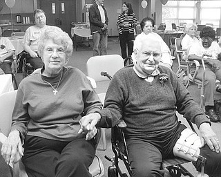 Music makes this a party: Mr. and Mrs. Harnichar enjoy the music at a special Mothers/Fathers Day party at the Antonine Sisters Adult Day Care in North Jackson. The party began at 10:30 a.m. June 9 with music and dancing, followed by a meal of tossed salad, ham, mashed potatoes and green beans. Door prizes were available for drawings, including a $20 gift card donated by the Giant Eagle store in Austintown, a candle set, a candle holder and a gift certificate for the day care beauty shop. A towel set, picnic basket, bath set and chocolate candies were all donated by Wal-mart in Austintown. Cakes and desserts, also from Wal-mart, helped to make the party special. An added touch was boutonnieres for the men, donated by Crystal Vase.
