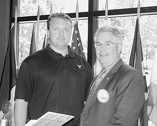 Game plan outlined: Boardman Rotary Club welcomed Eric Wolford, left, football coach at Youngstown State University, to its June 11 meeting, where he spoke of plans for the 2010 season and of his decision to return to the Valley after 20 years. He plans to introduce several events to bring the team and community closer together. These include kids’ camps, Football 101 camps for women, tailgating with the players, and his own foundation to support children with special needs. He said the Valley is a great place to raise his kids. He complimented Ron Strollo, YSU athletic director, for his support in preparing top-rate facilities that will help bring high quality recruits to the team. Thanking the coach for spending time with the group was Bob Mastriana, club president.