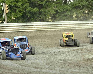 ROBERT K. YOSAY | THE VINDICATOR..Running fast and wheel to wheel drivers jockey for position at Deerfield Raceway on the outskirts of Deerfield on State Route 224 .-30-