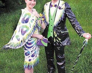 Sara Cummings of Springfi eld and James Ludt of Struthers strike a pose in duct-tape attire on their way to Cardinal Mooney’s prom. The two are fi nalists in the 10th annual Stuck at Prom scholarship contest and could win $3,000 each. Online voting in the contest begins today.